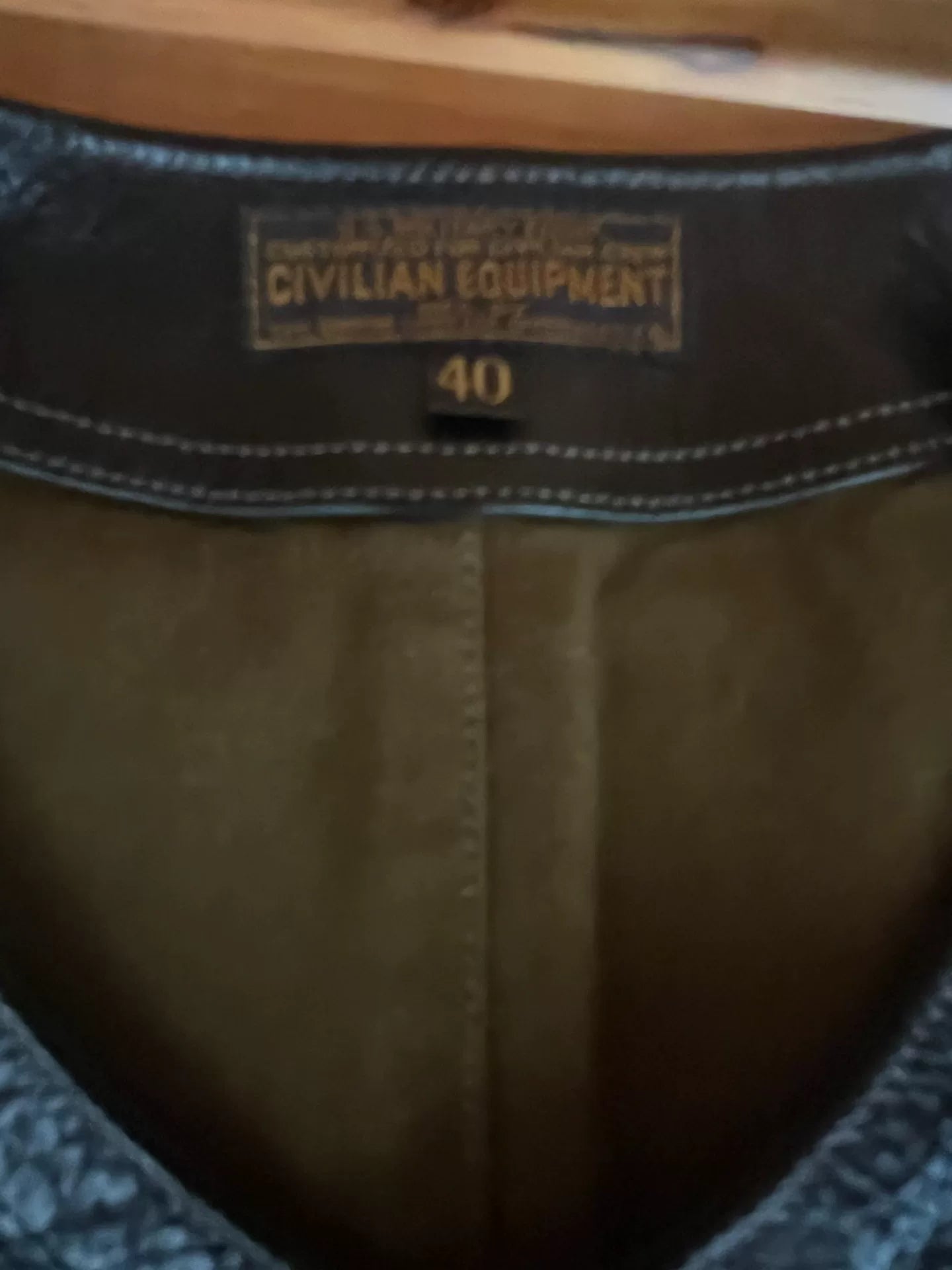 black leather vest with military green lining