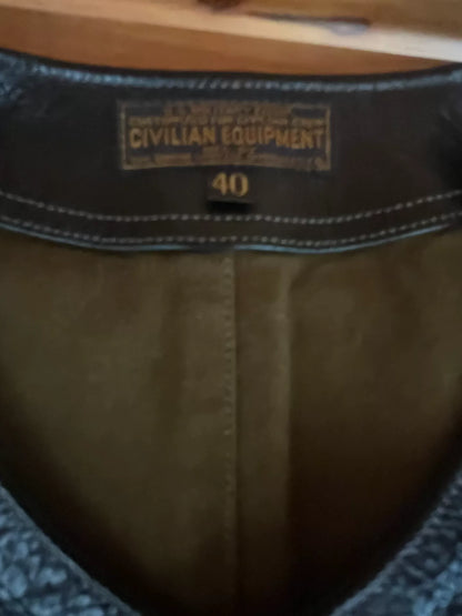 black leather vest with military green lining