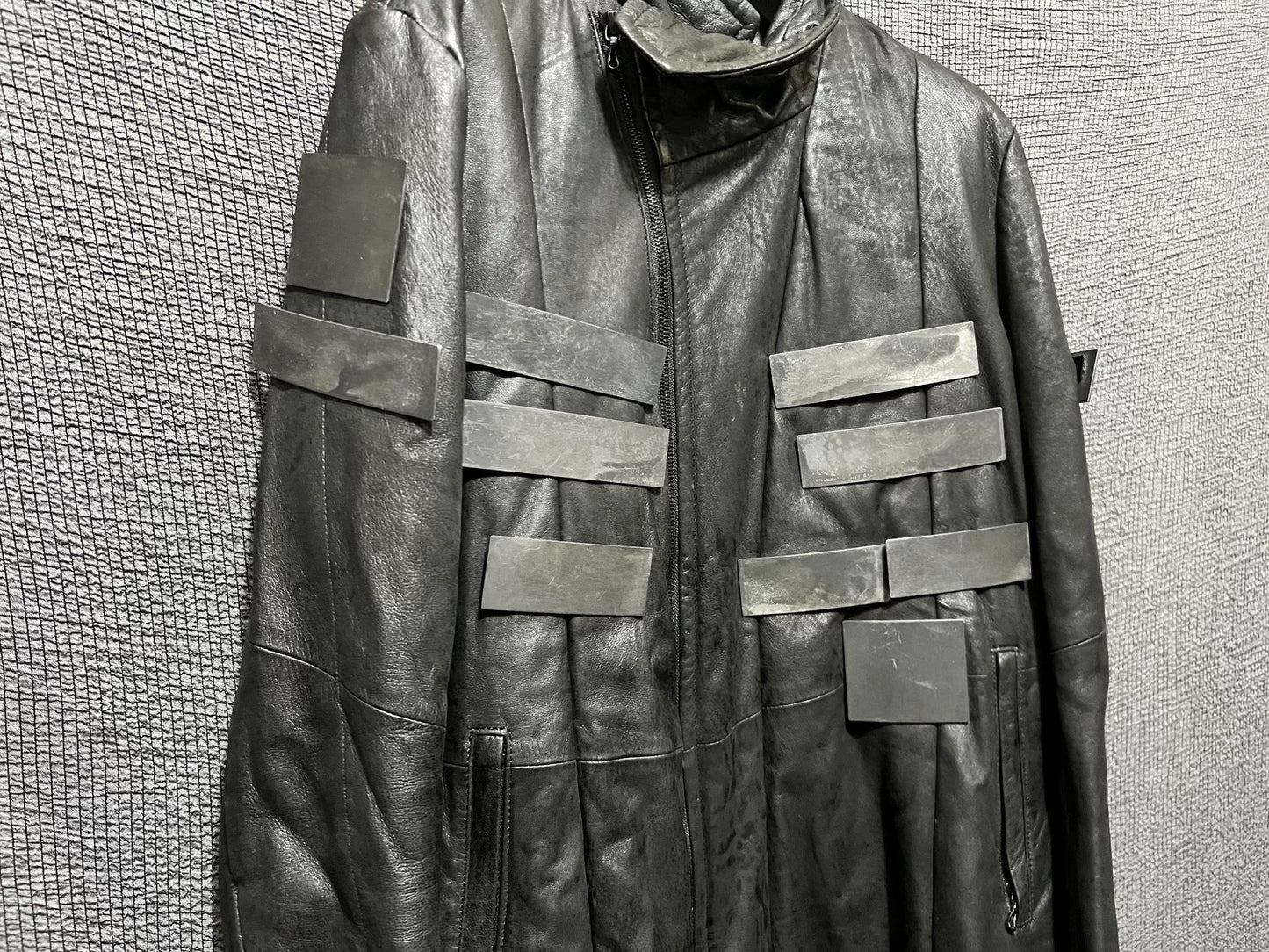 avant-garde leather jacket with metal elements