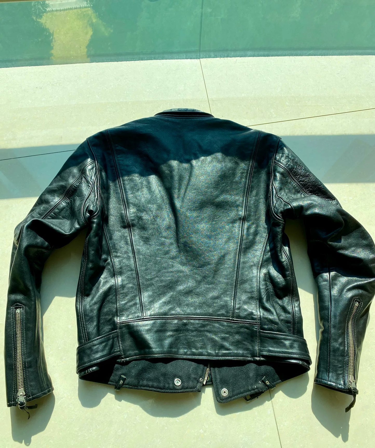 black leather biker jacket with detailed embellishments