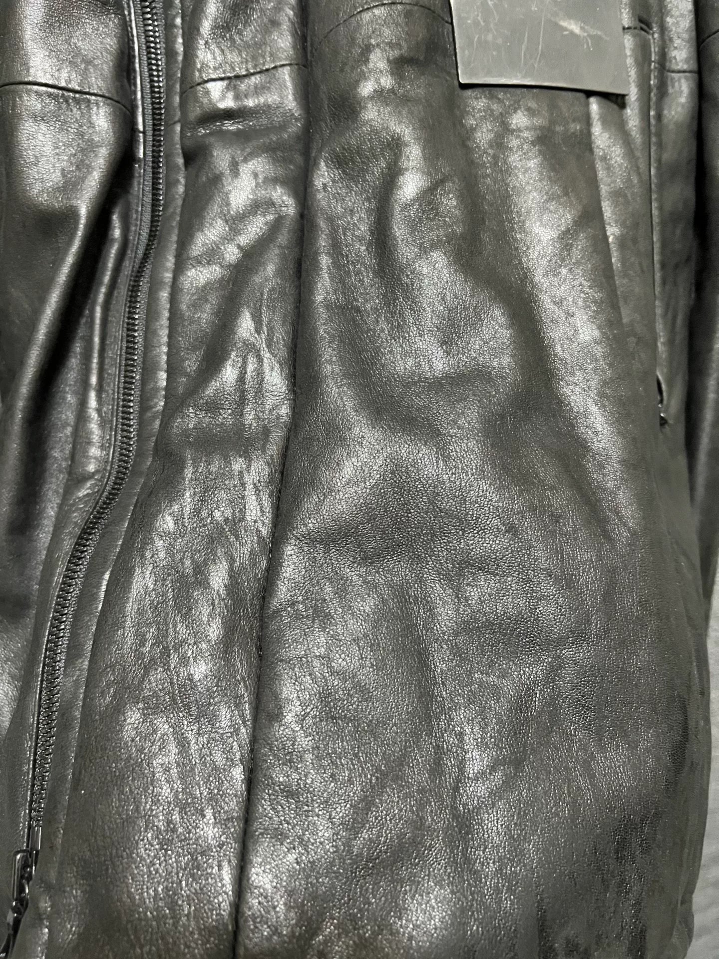 avant-garde leather jacket with metal elements