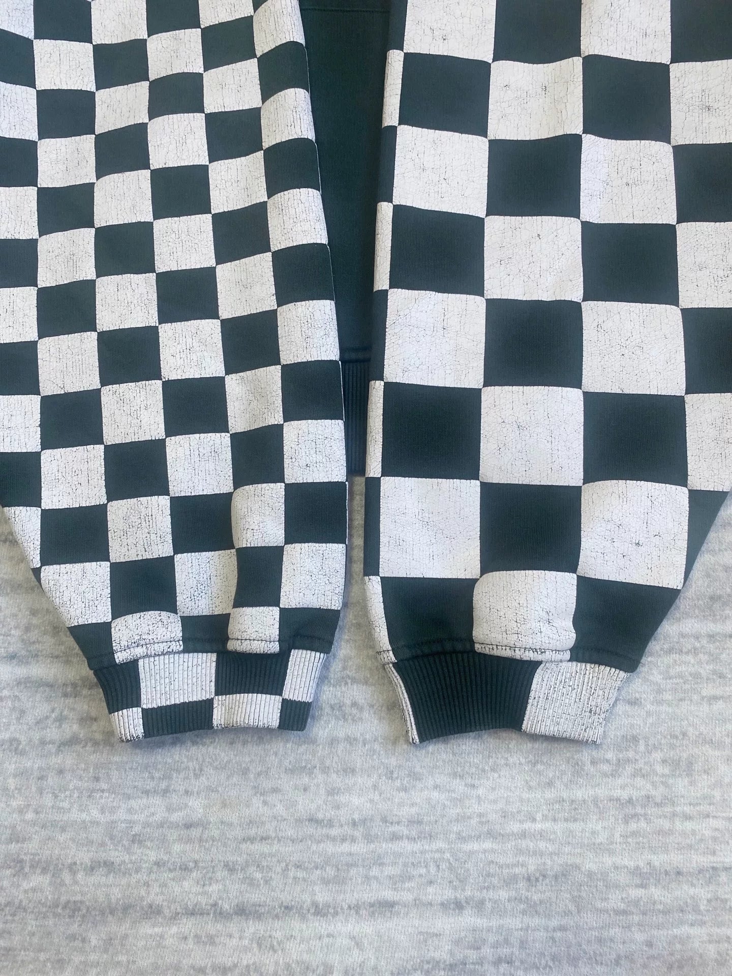 black and white checkered hoodie with red hood