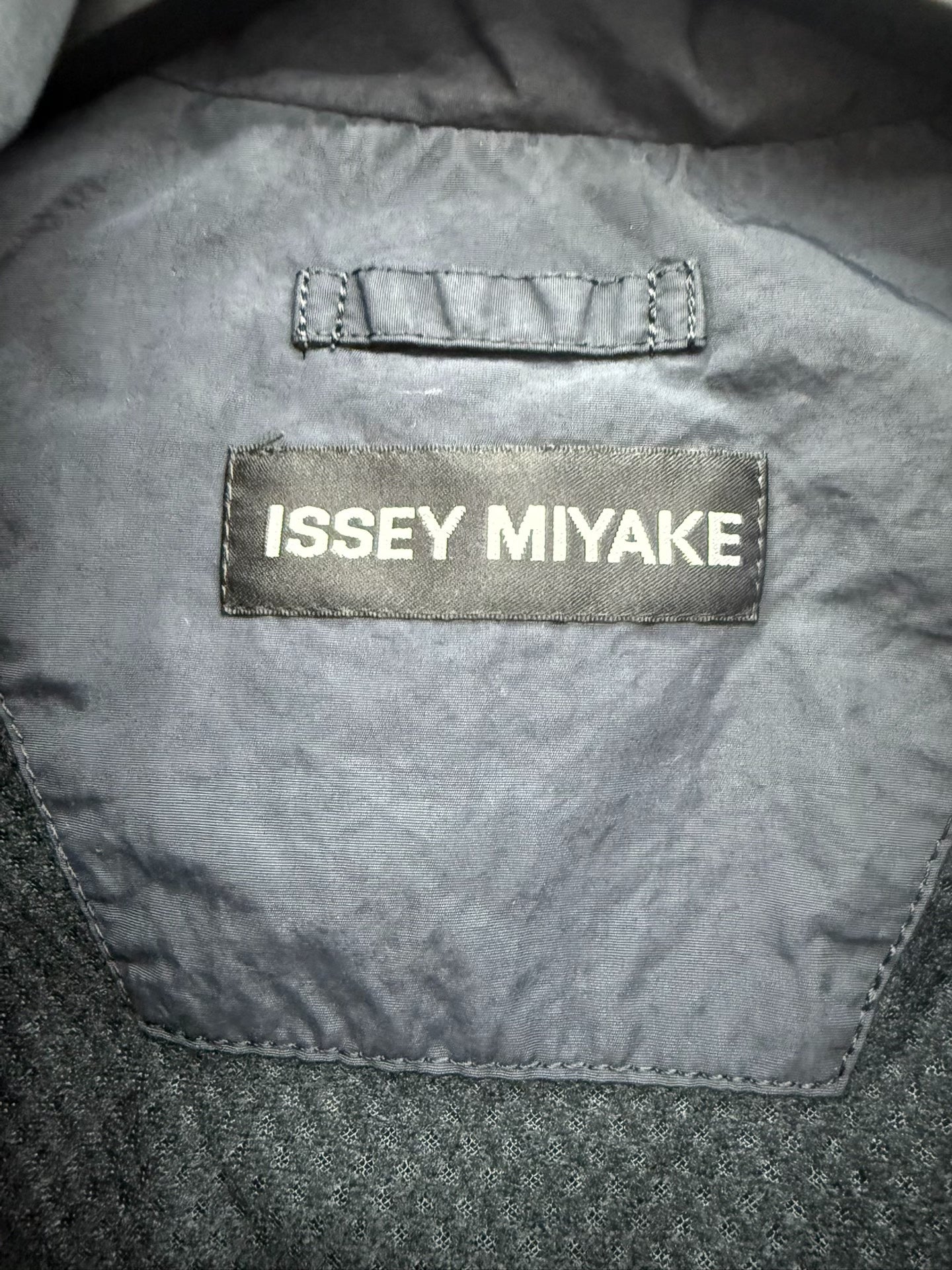 issey miyake zip-up jacket with damaged zipper