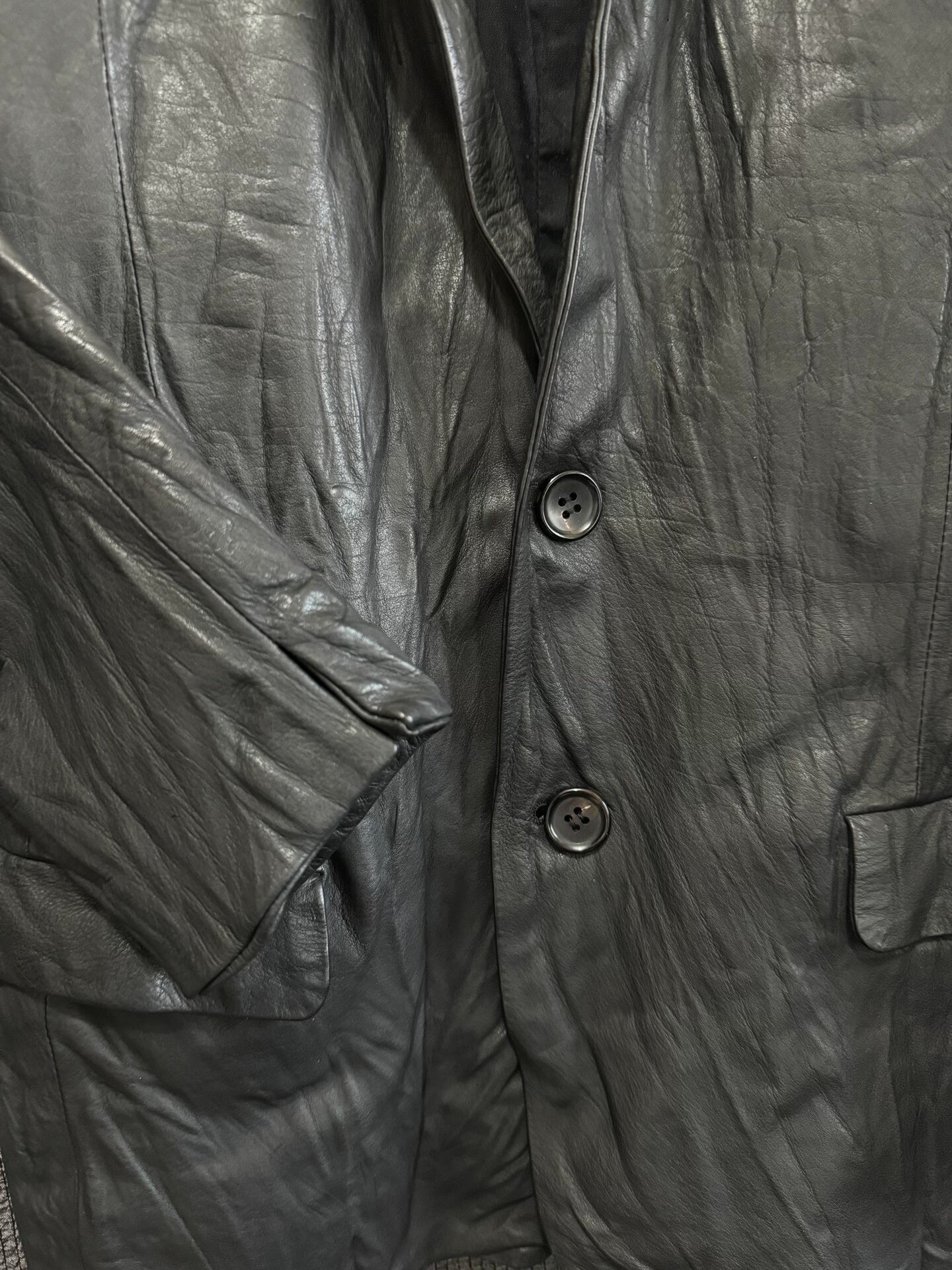 avant-garde crumpled leather suit jacket