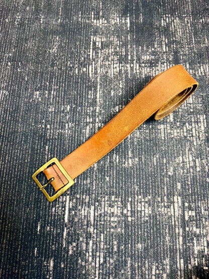brown leather belt with gold buckle