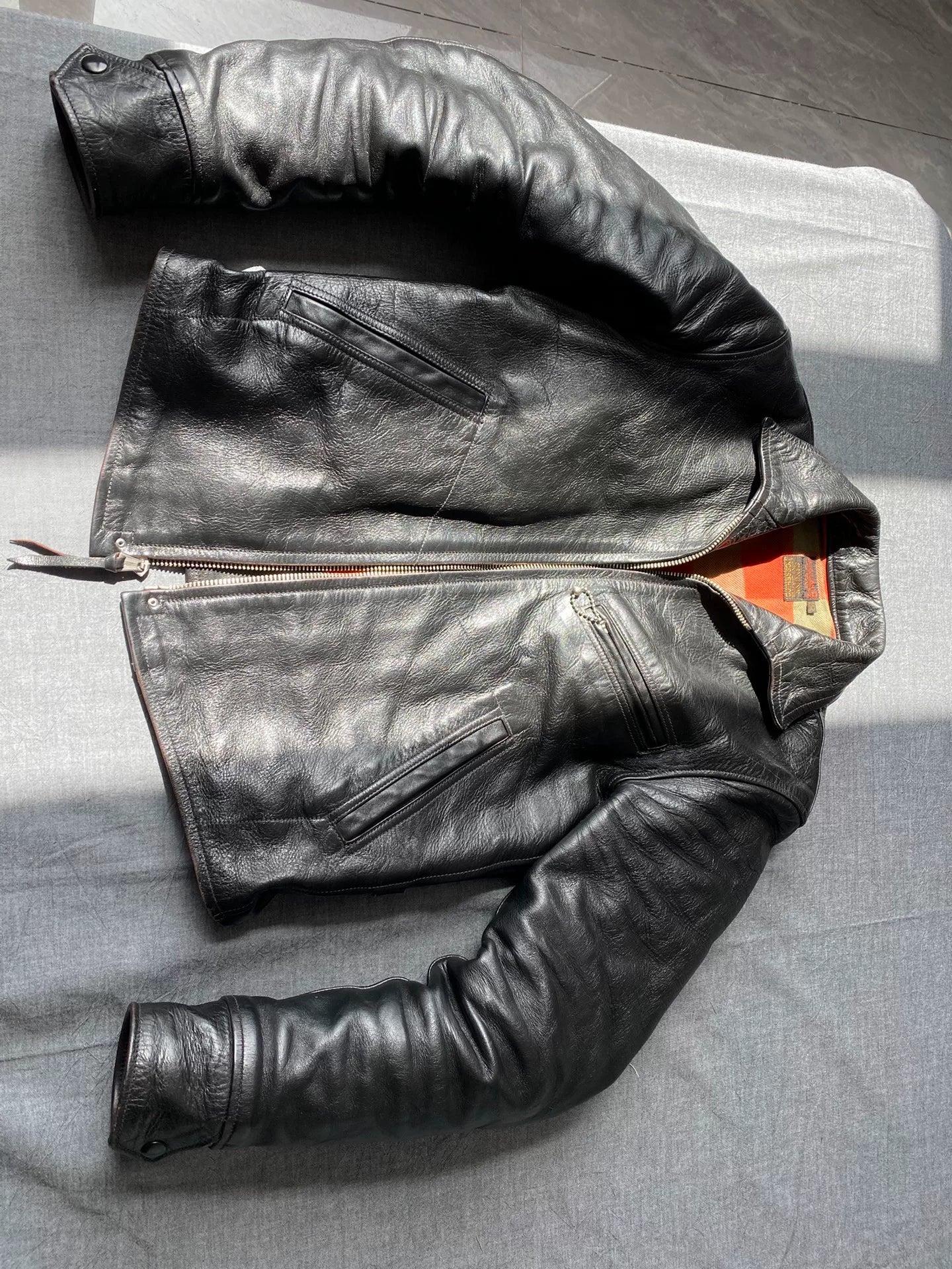 black leather jacket with snowflake design