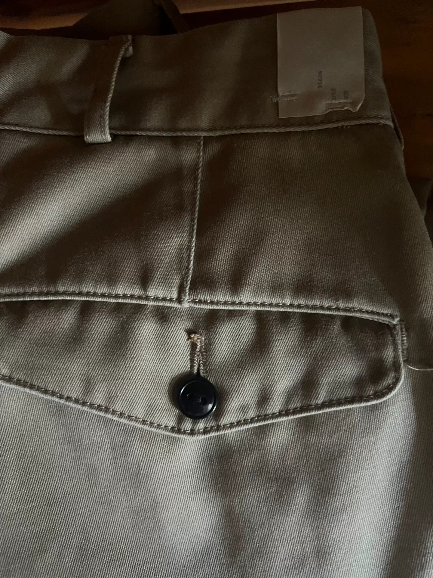 khaki pants with custom zipper details