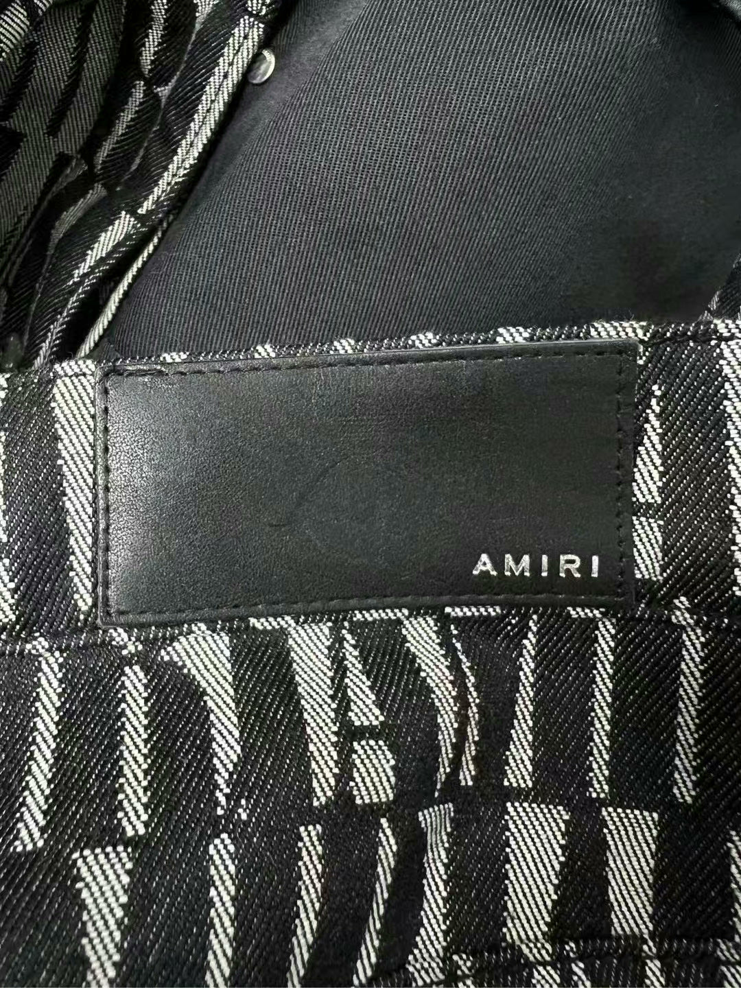 amiri logo detail side button jeans