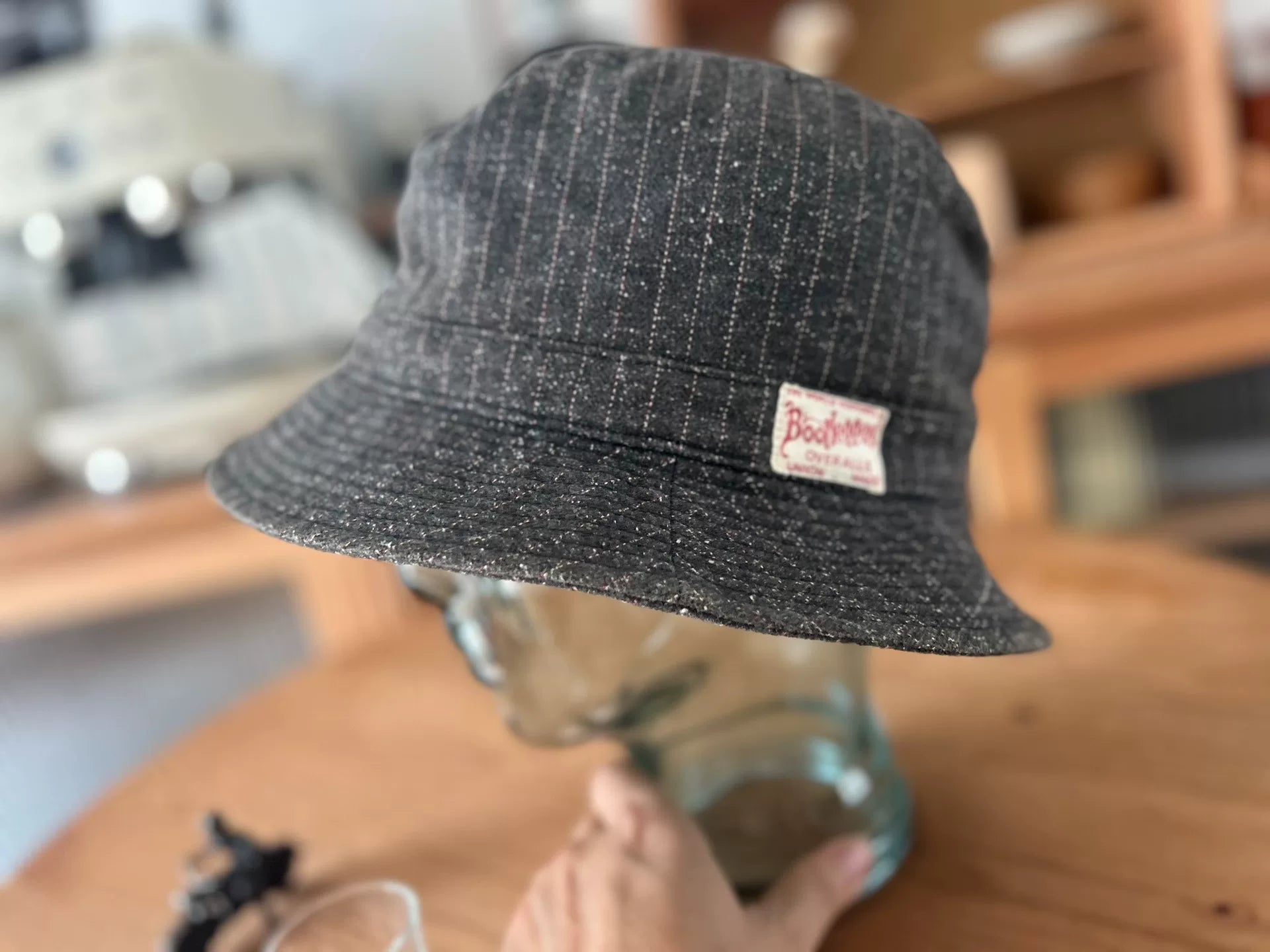 unique gray bucket hat with logo patch