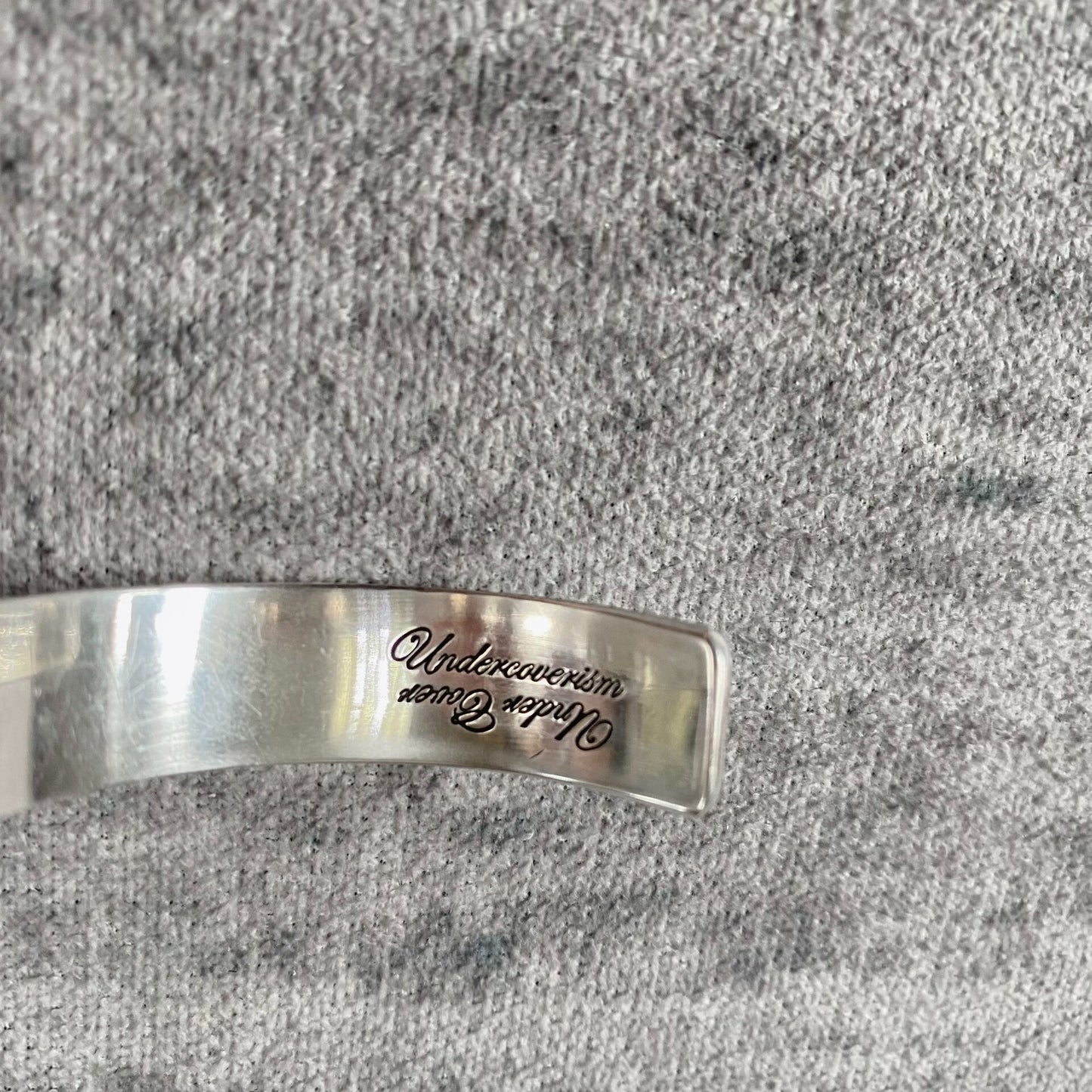 silver adjustable bracelet with teeth design