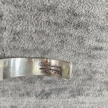 silver adjustable bracelet with teeth design