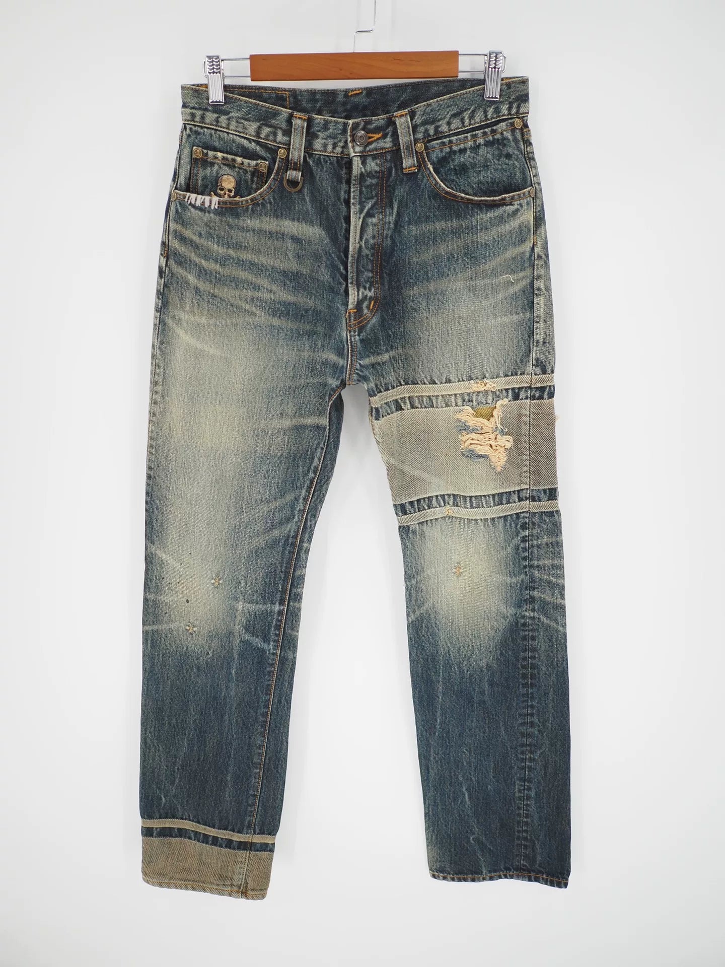 blue denim jeans with gold detail