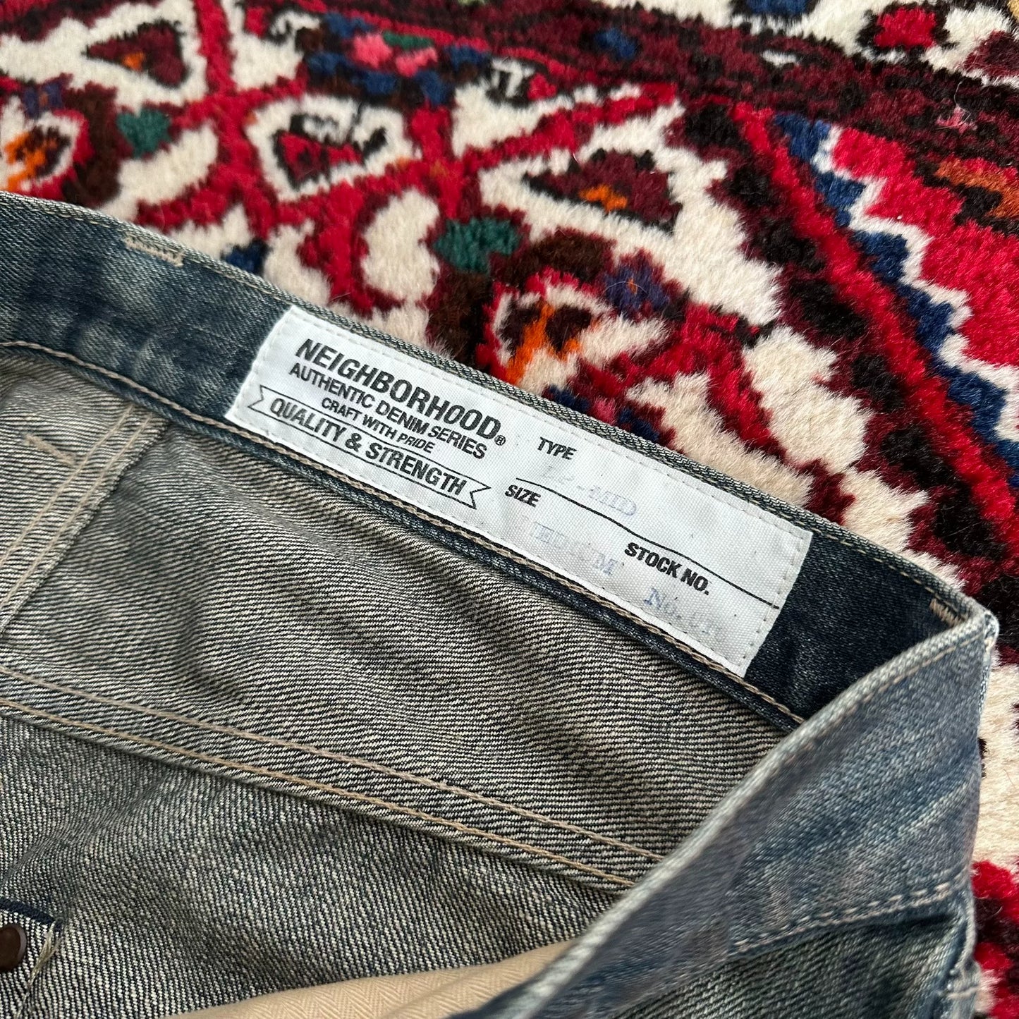distressed blue jeans with unique detailing