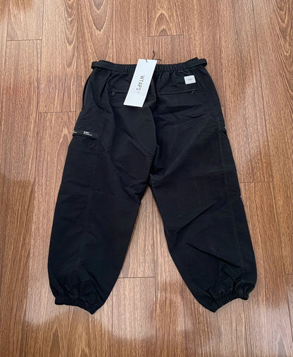 wtaps nylon track trousers in black