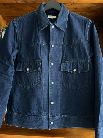blue dyed work jacket with gem buttons