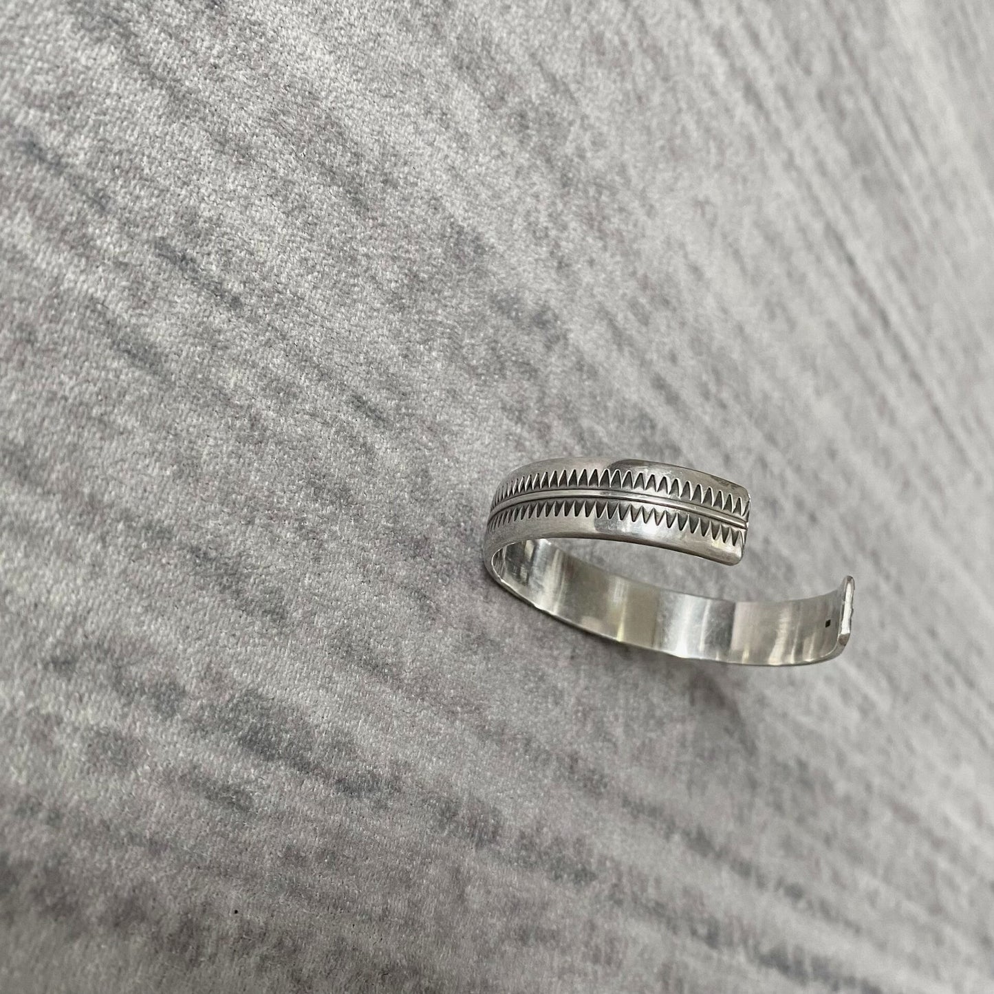 silver adjustable bracelet with teeth design