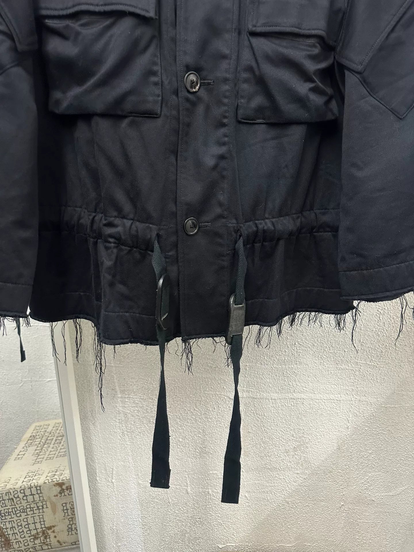 black oversized jacket with frayed hem