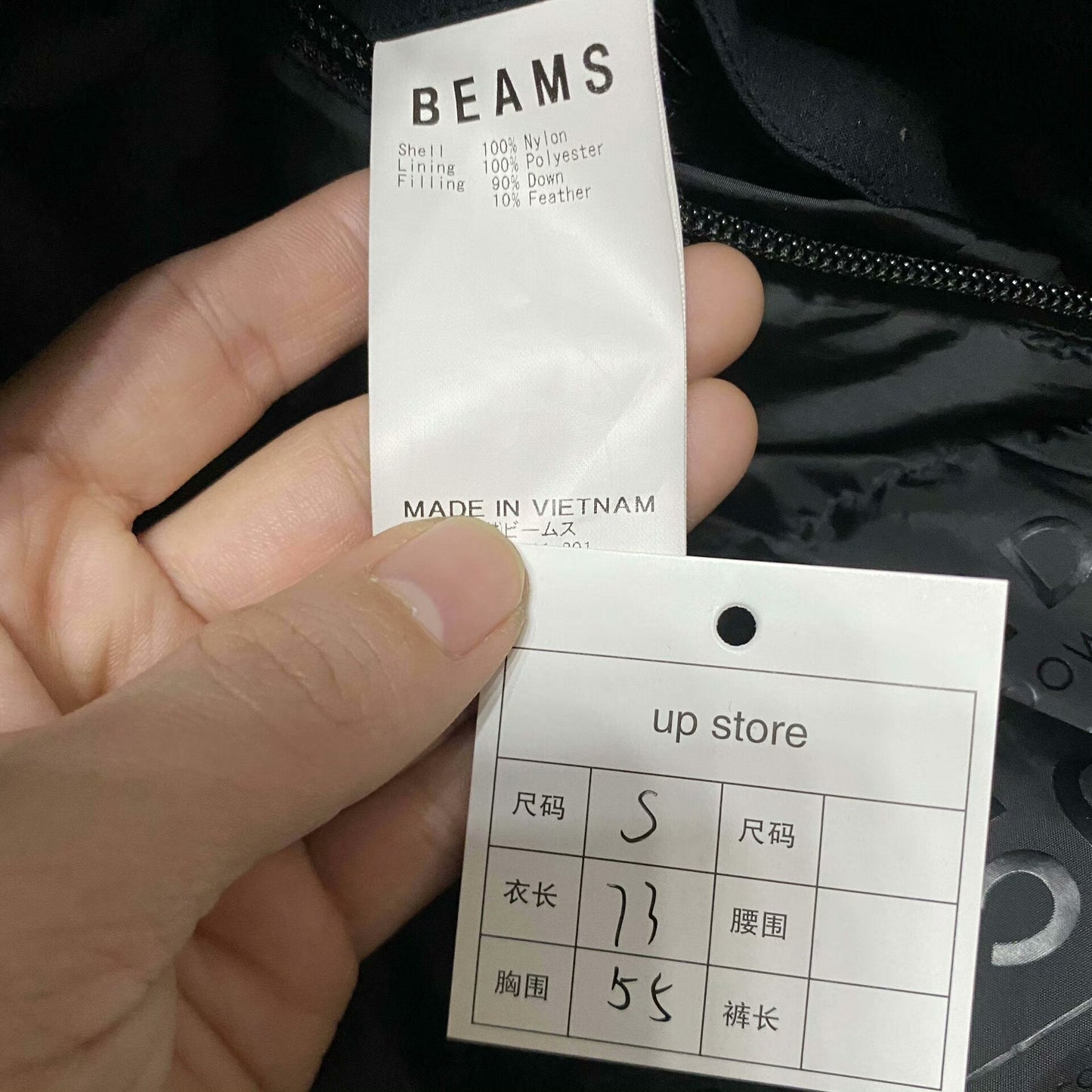 black waterproof puffer jacket by BEAMS