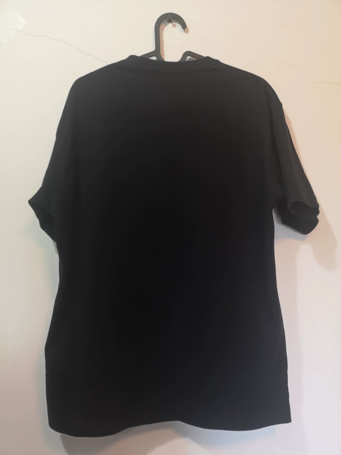 black short sleeve t-shirt with slogan
