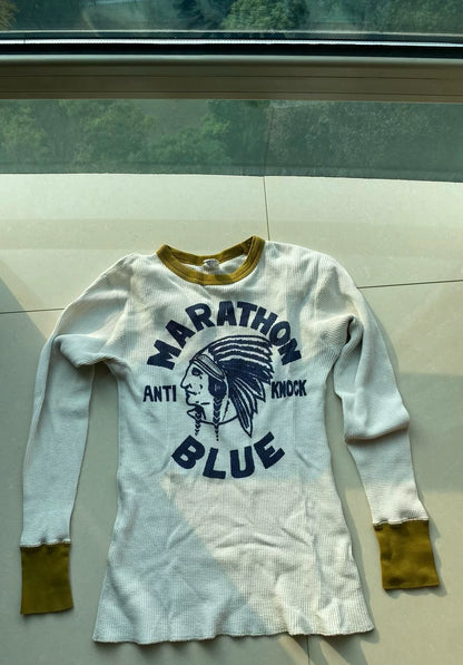 white and gold long sleeve graphic shirt