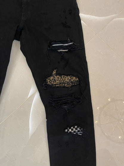 Amiri Black Denim Pants with Artistic Features