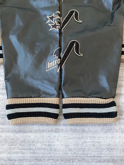 beige baseball jacket with leather sleeves