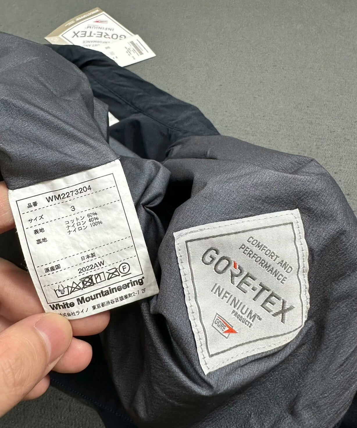 white mountaineering gore-tex coach jacket