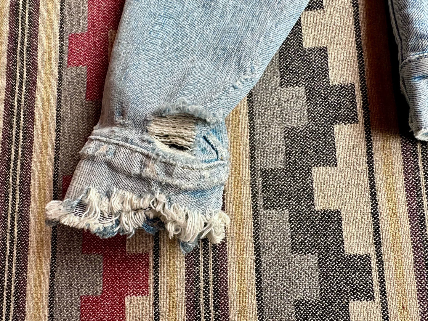 denim jacket with distressed details