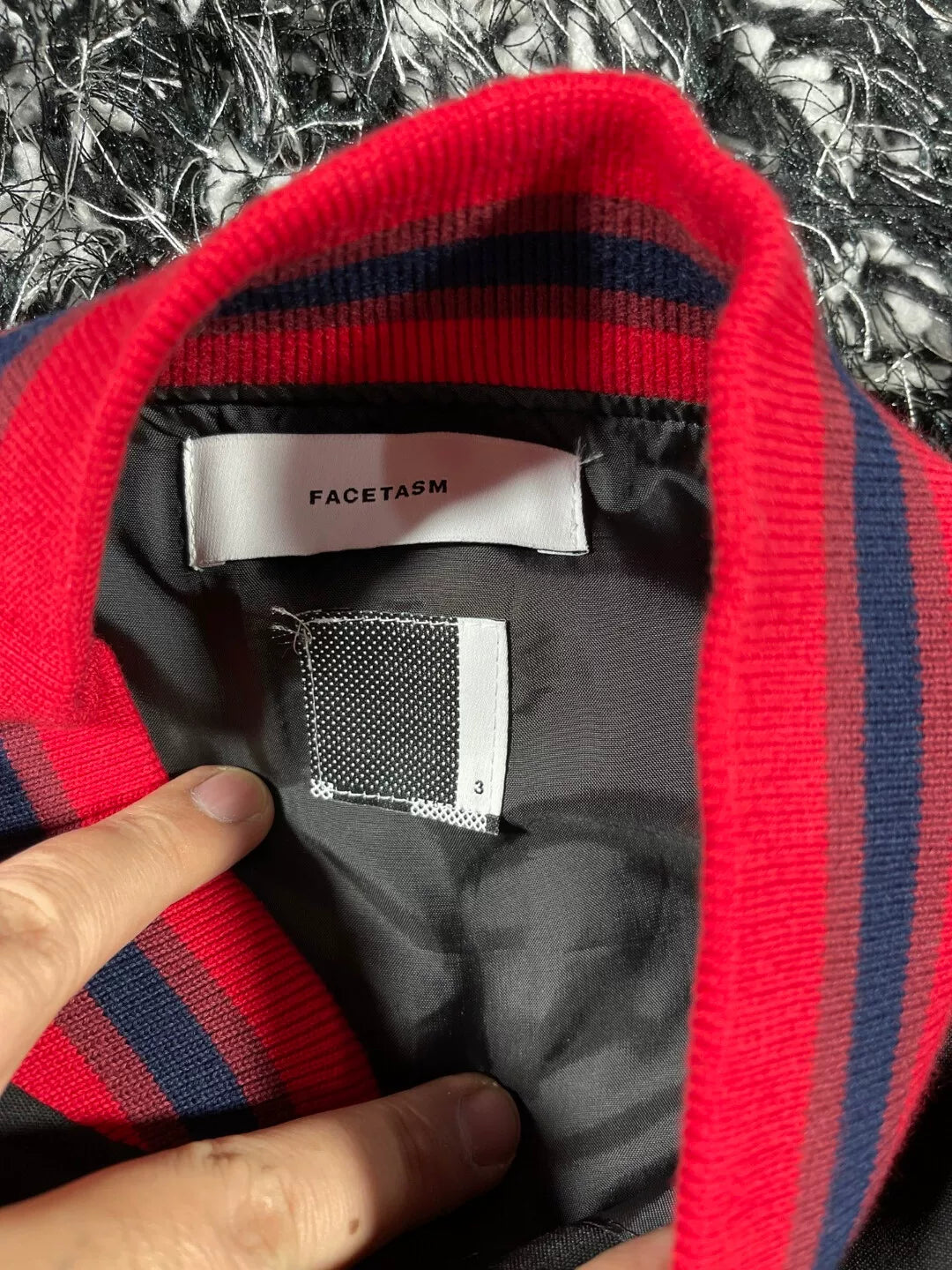 facetam black jacket with red accents