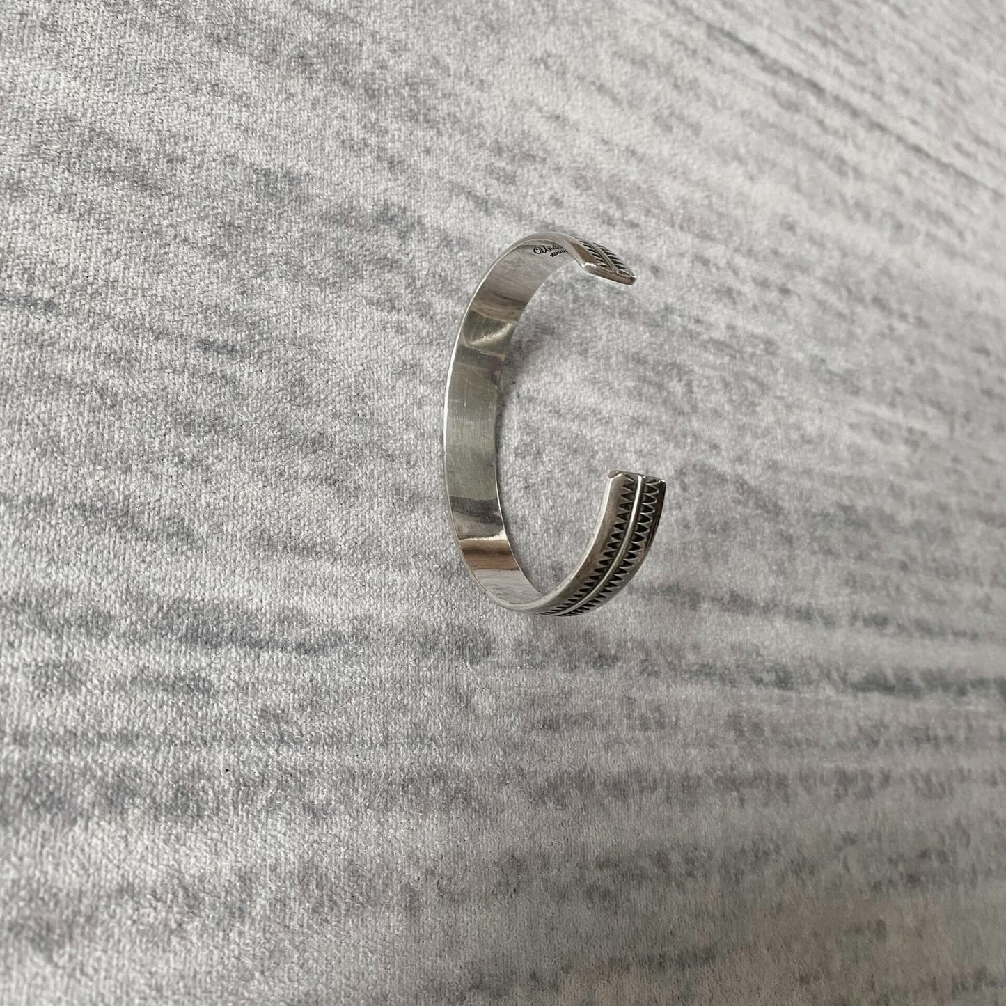 silver adjustable bracelet with teeth design