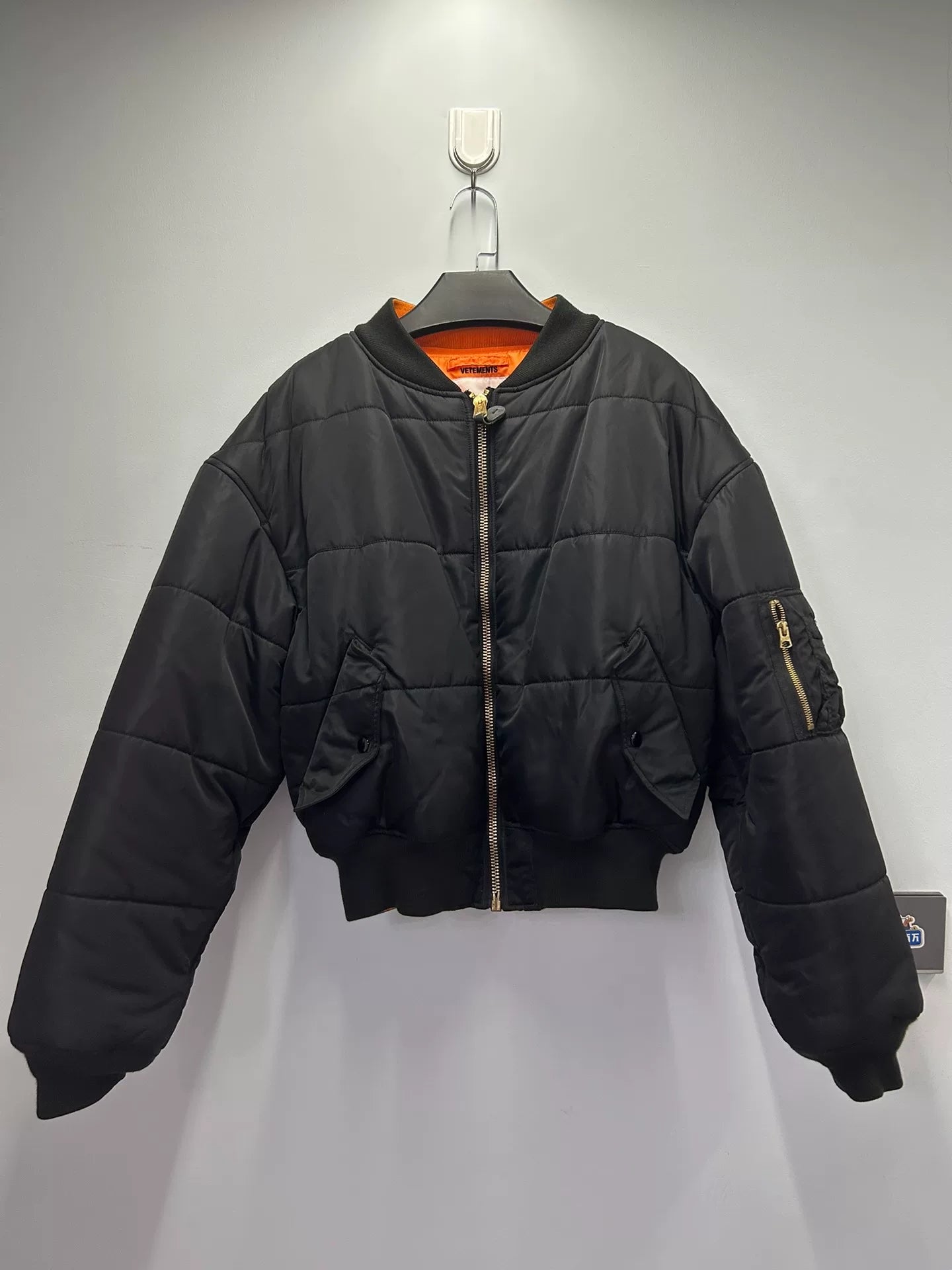 reversible black and orange bomber jacket