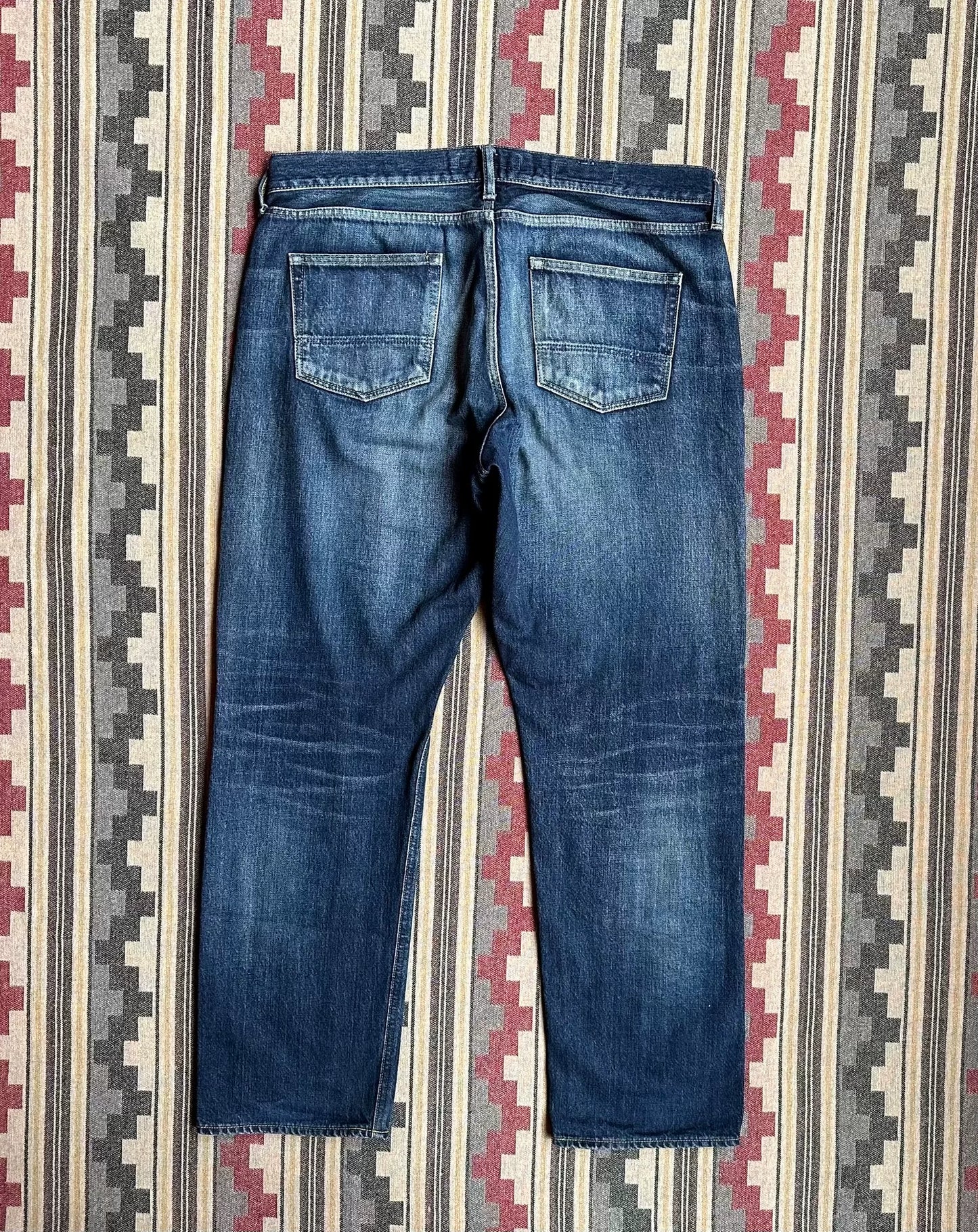 fdmtl slim fit denim with repair patches