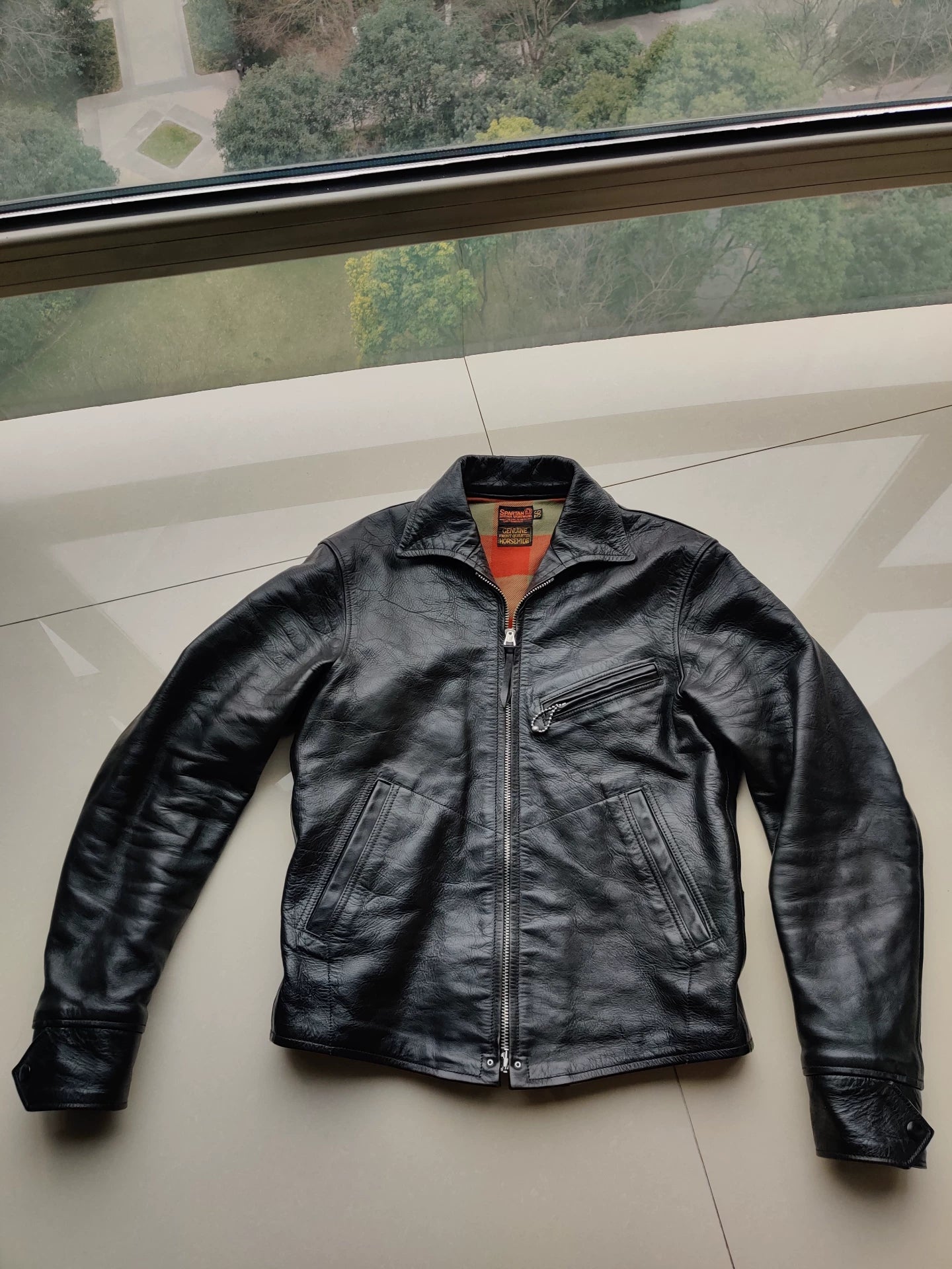 black leather jacket with snowflake pattern