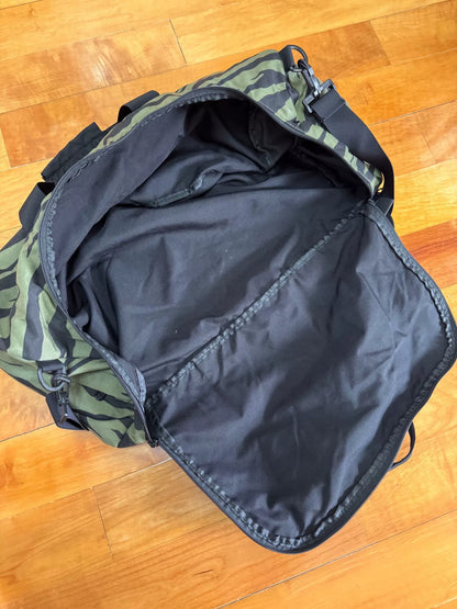 supreme camouflage duffle bag with red tag
