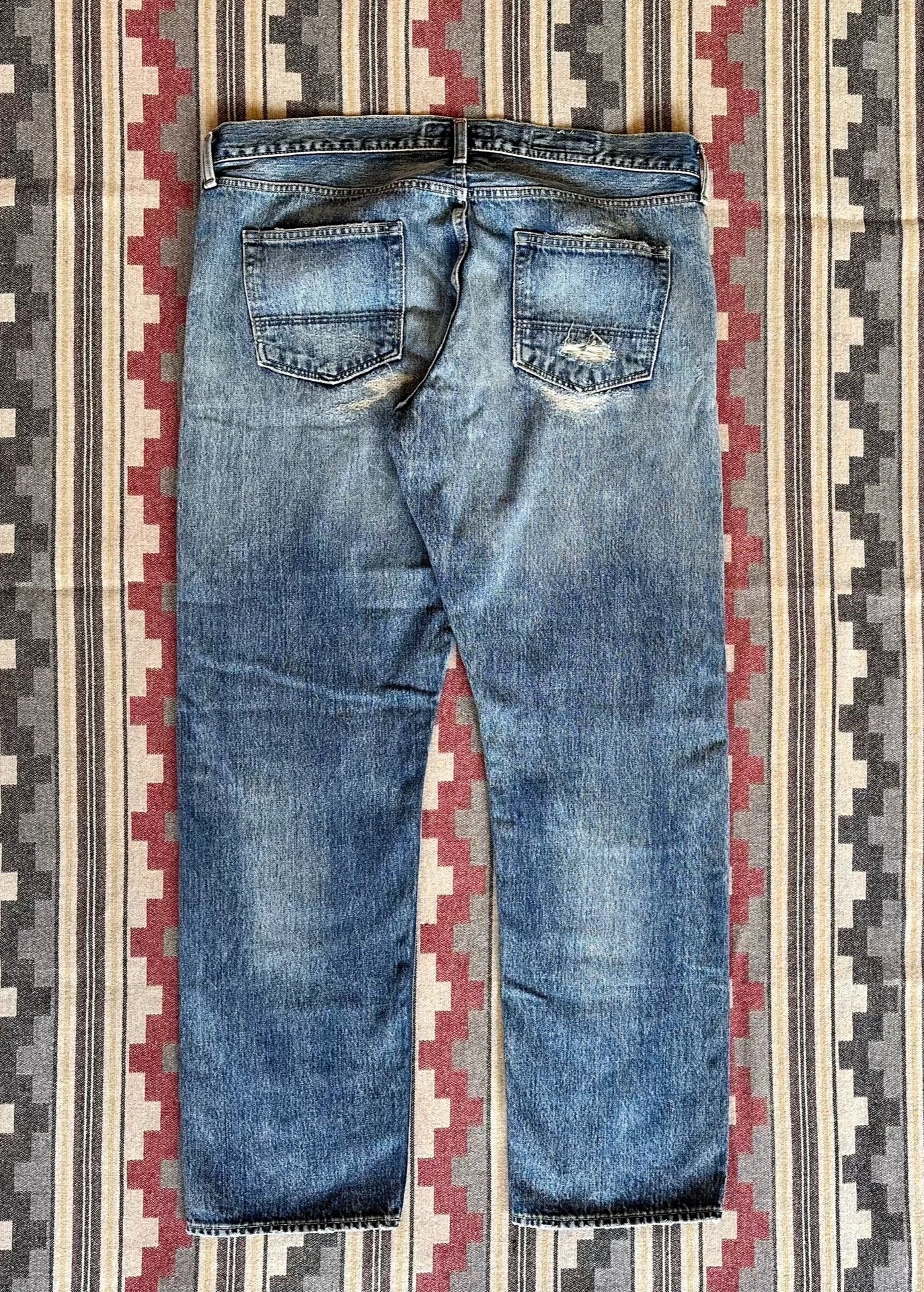 fdmtl slim fit distressed denim pants