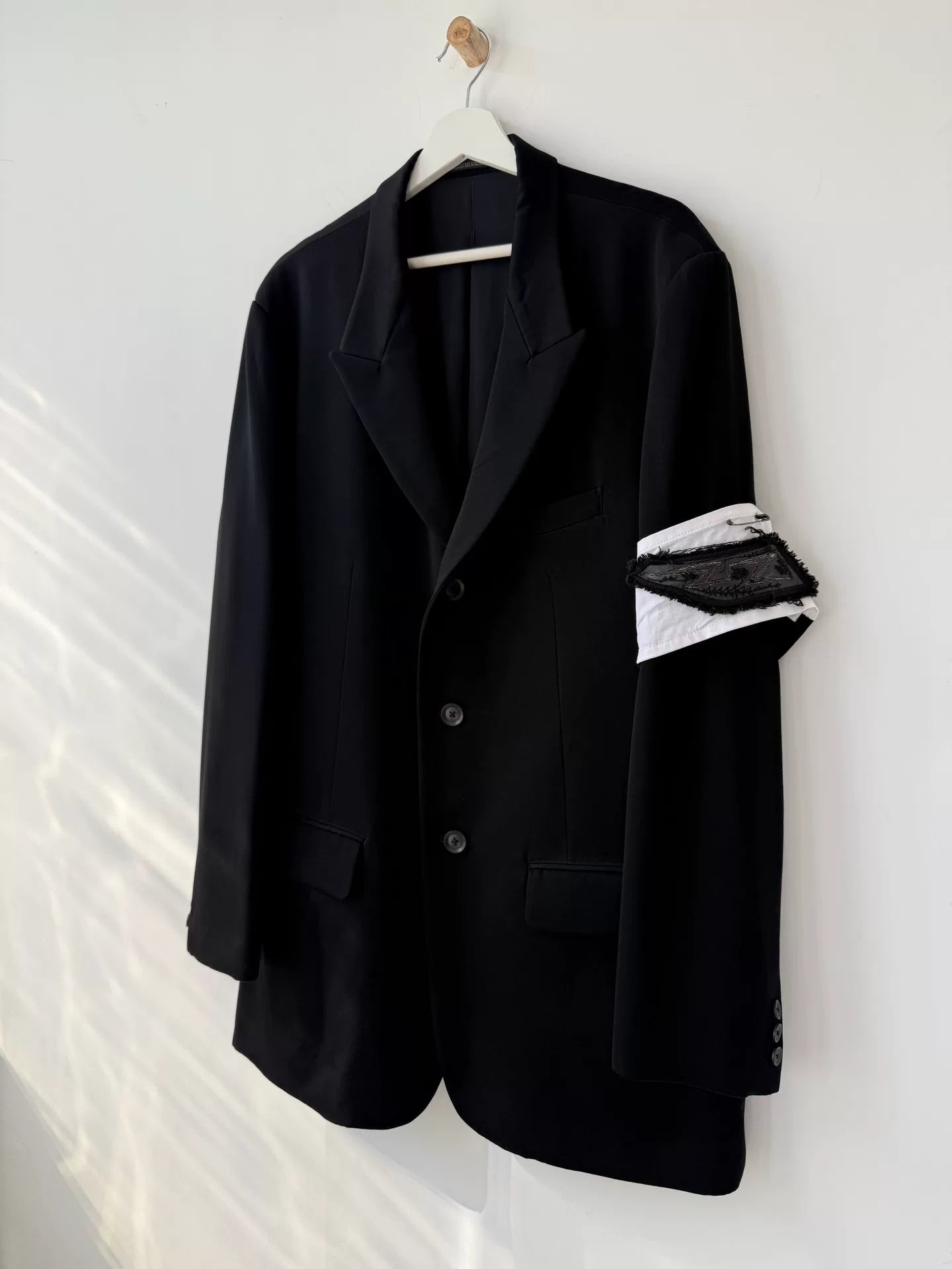 black wool suit jacket with white detail