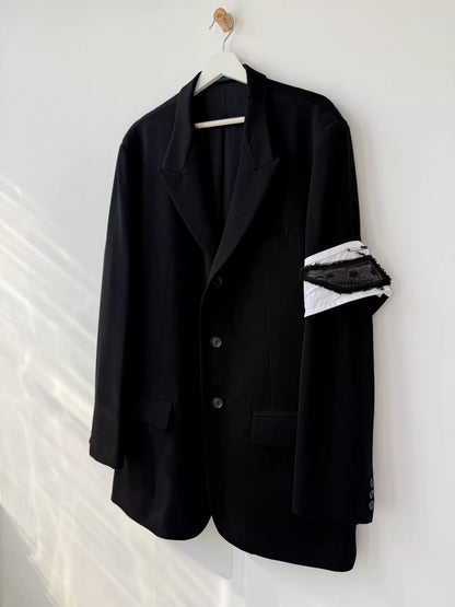 black wool suit jacket with white detail