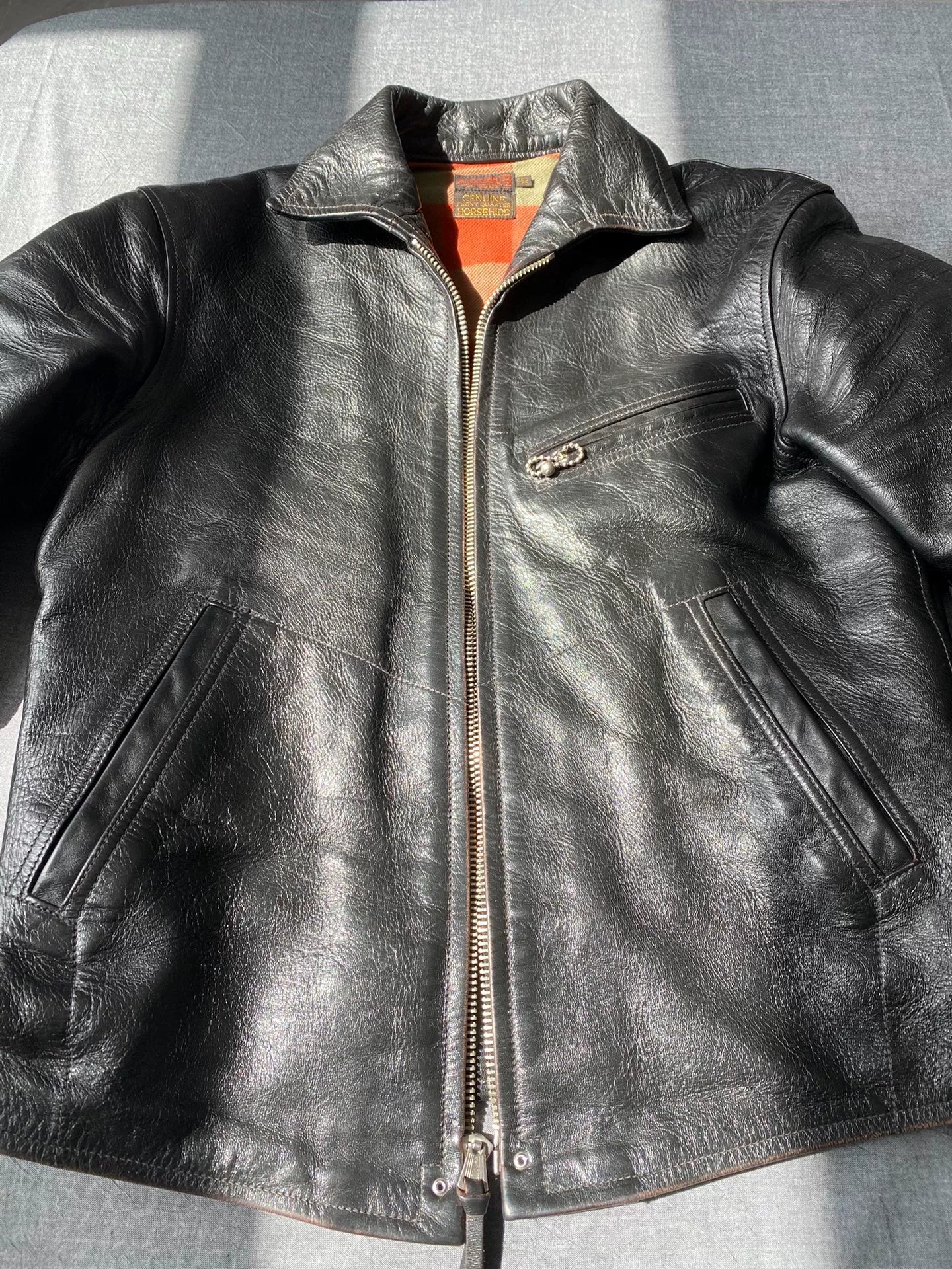 black leather jacket with snowflake design