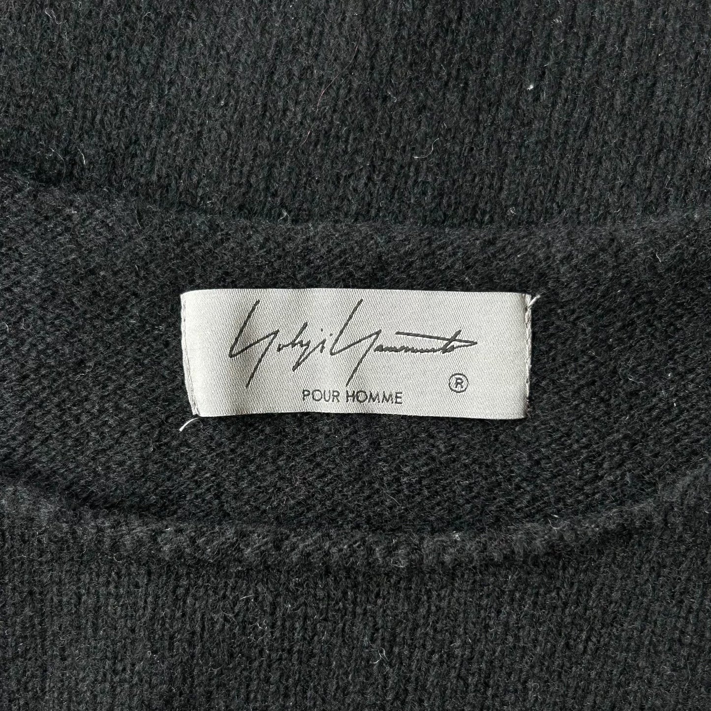 black sleeveless knit vest with floral design