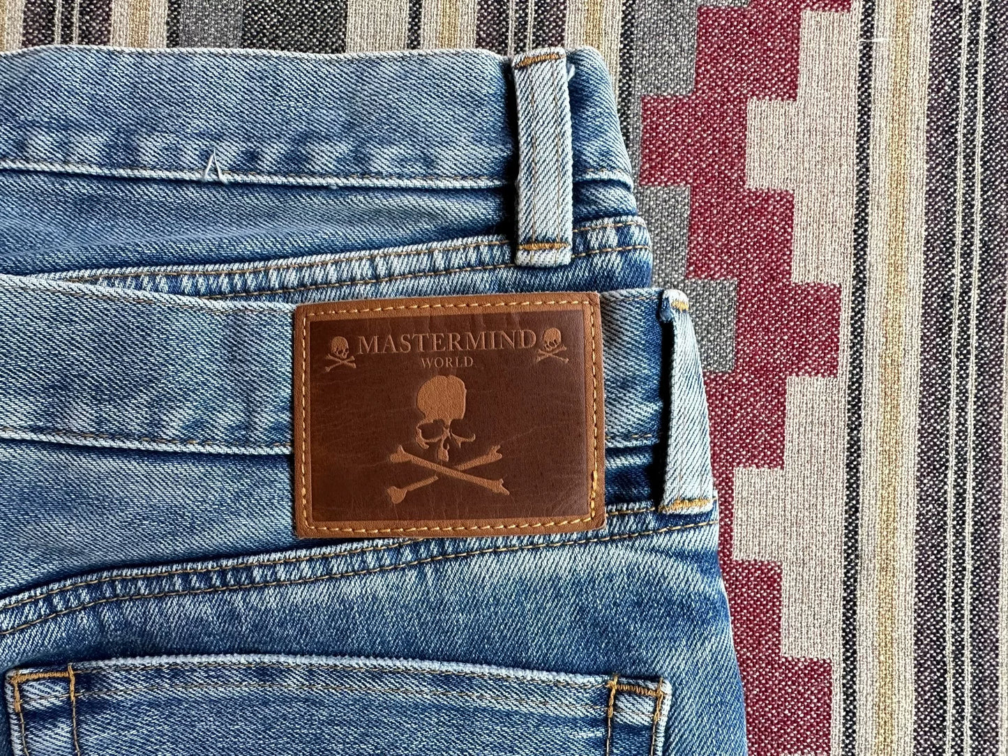 mastermind world skull embroidery denim pants