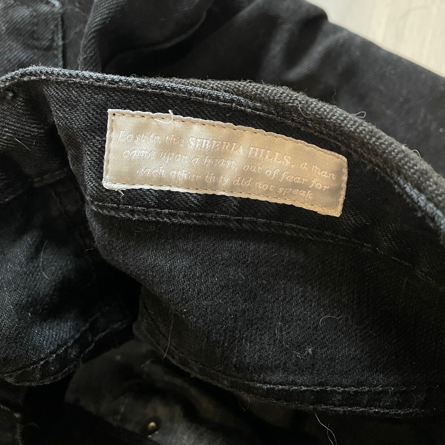 black studded straight-leg denim pants