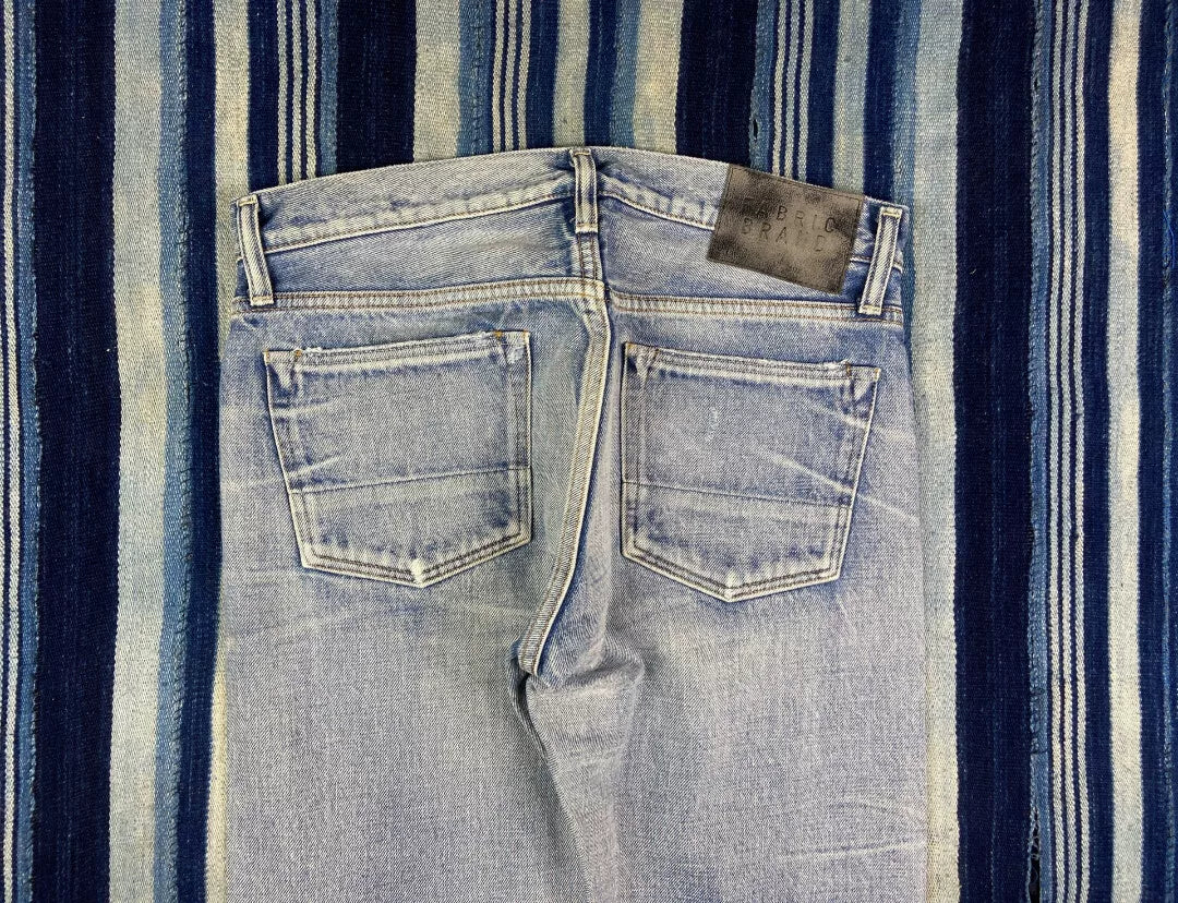 distressed raw wash denim jeans by fabric-brand&co