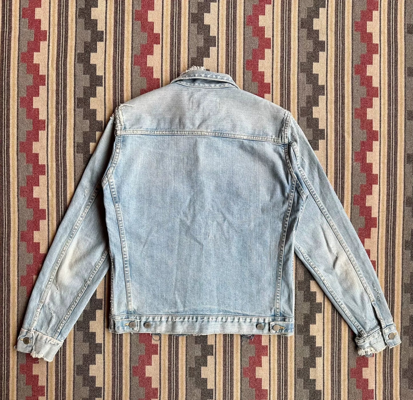 denim jacket with distressed details