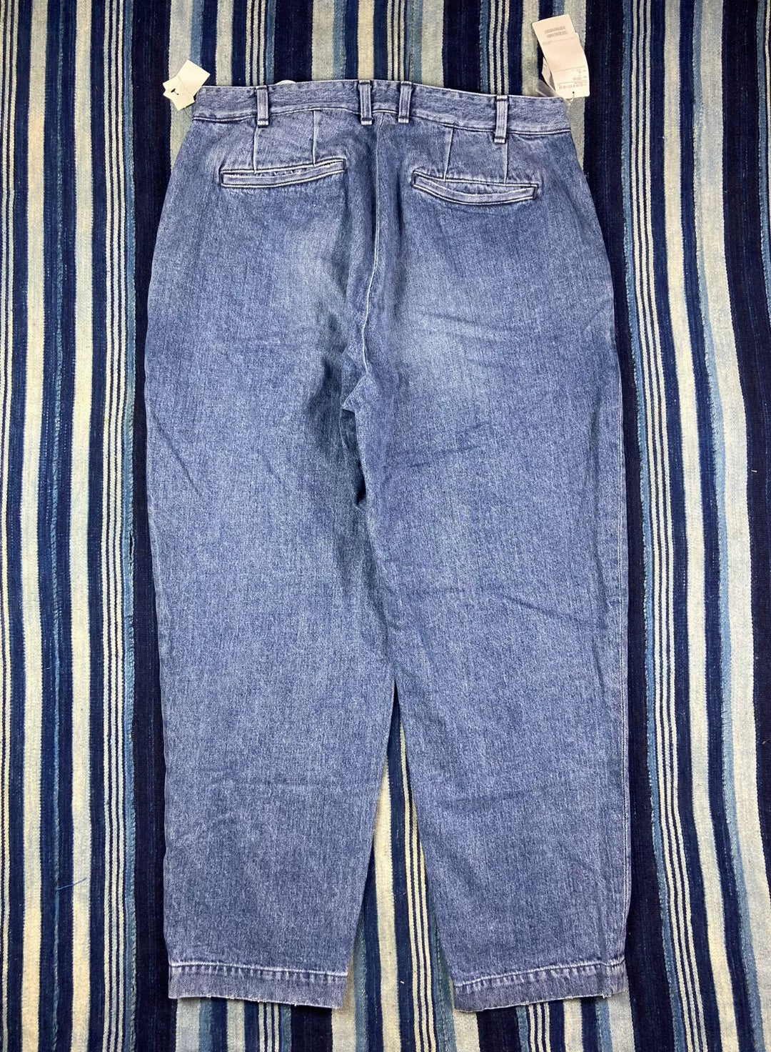 washed blue tapered denim pants for men