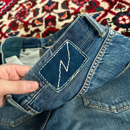 visvim mud-dyed wide-leg denim pants