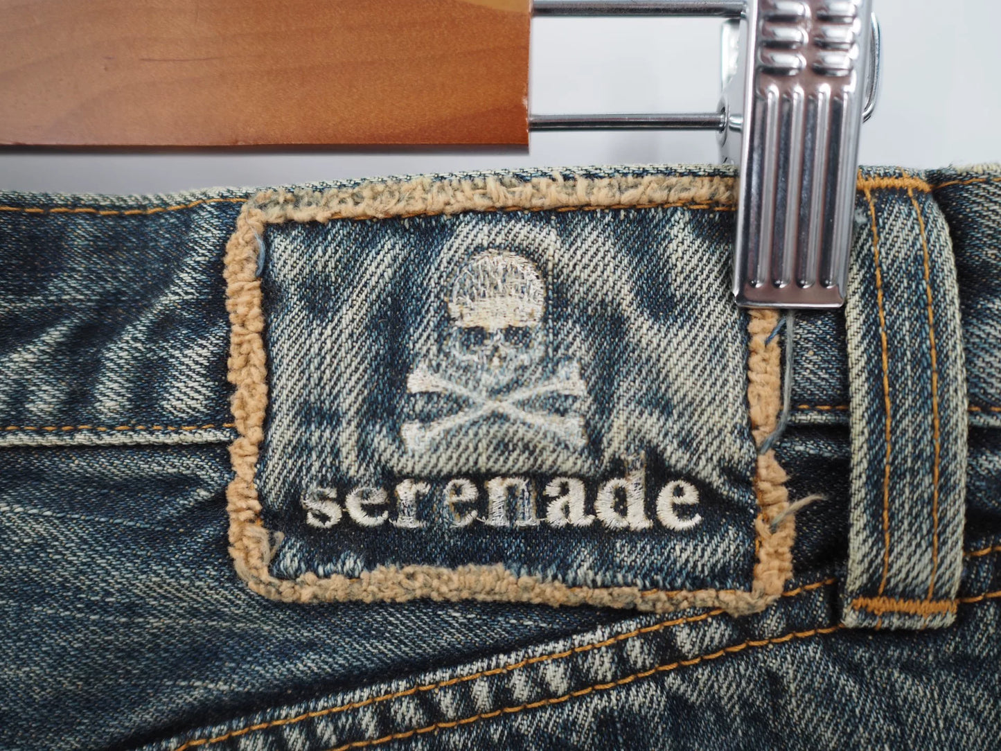 blue denim jeans with gold detail