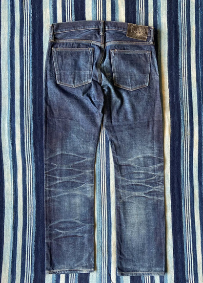 washed vintage-style raw denim jeans