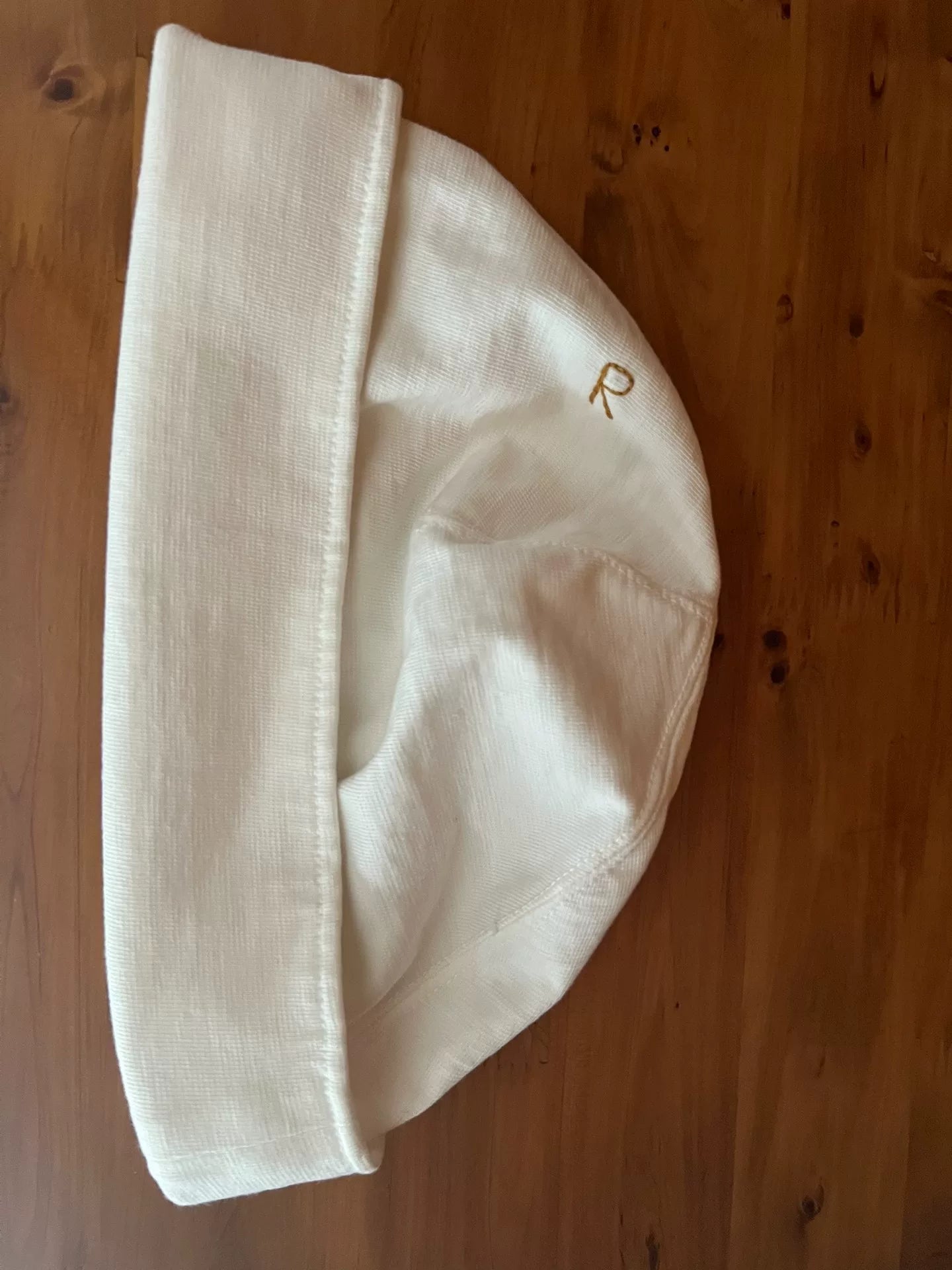 white knitted beanie with logo