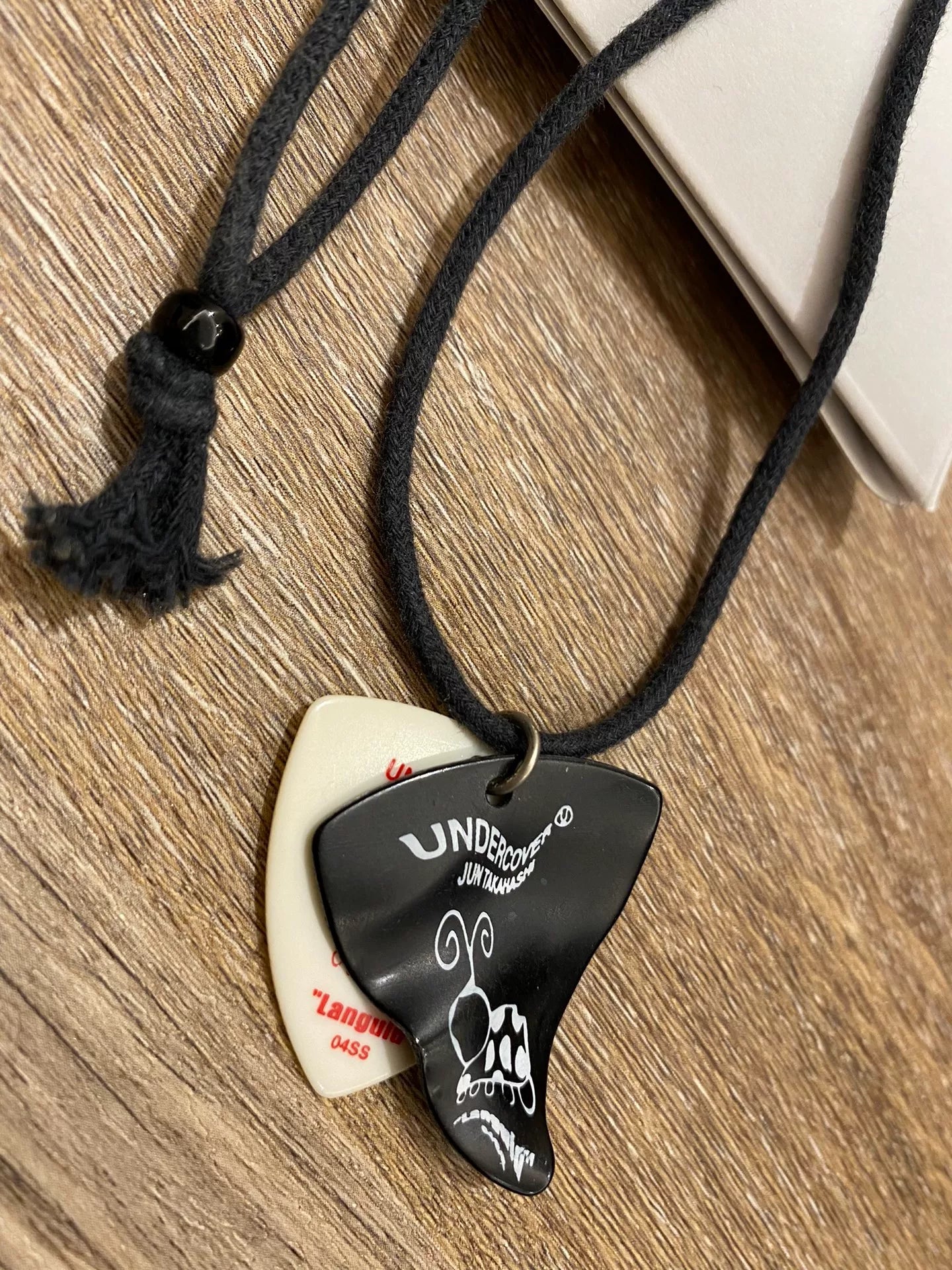 Undercover 04SS Dissolved Guitar Pick Necklace