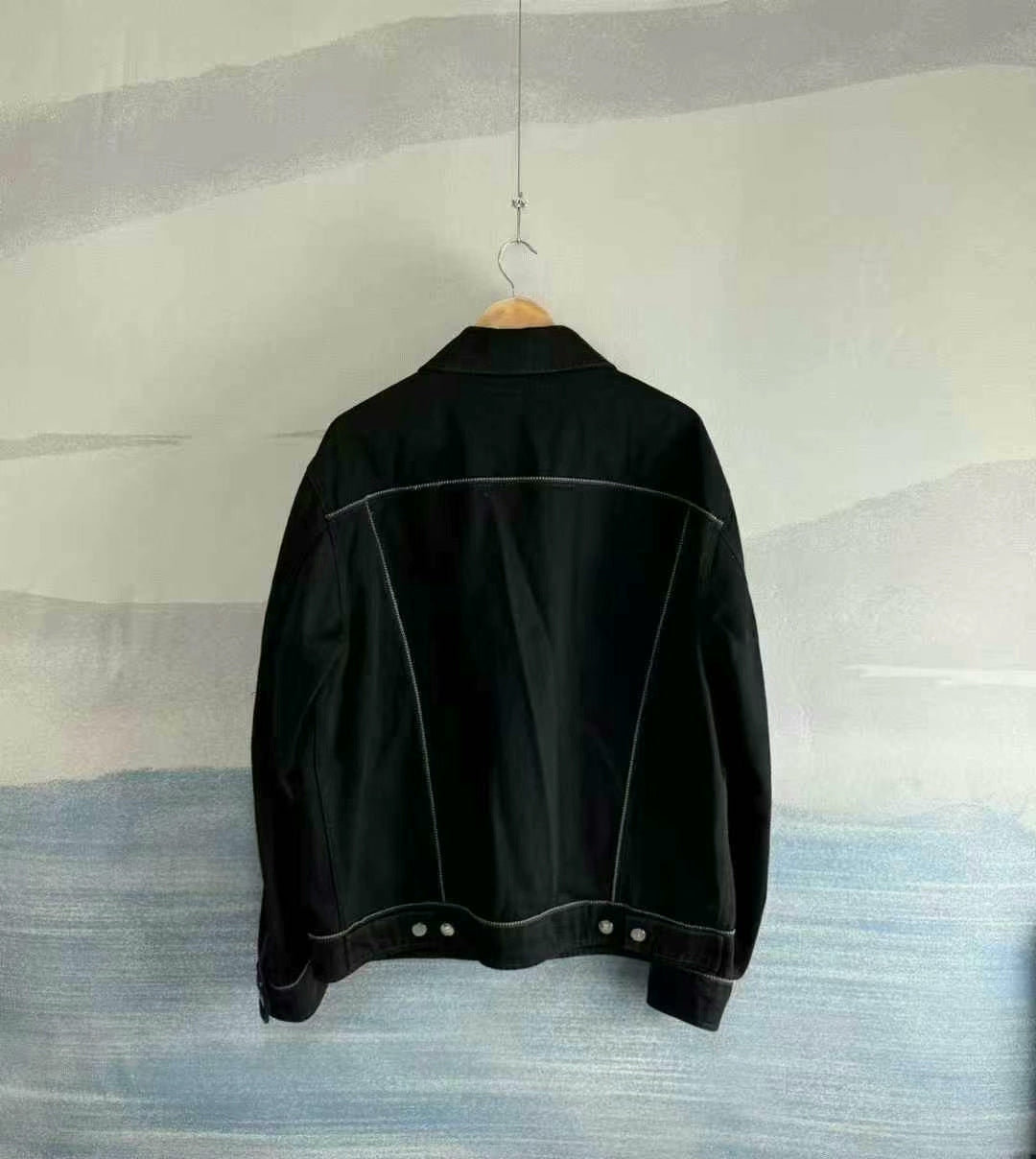 black denim jacket with logo patch